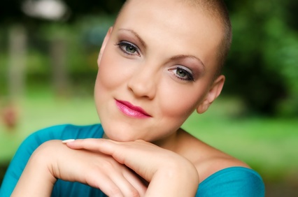 Happy and young cancer survivor after chemotherapy